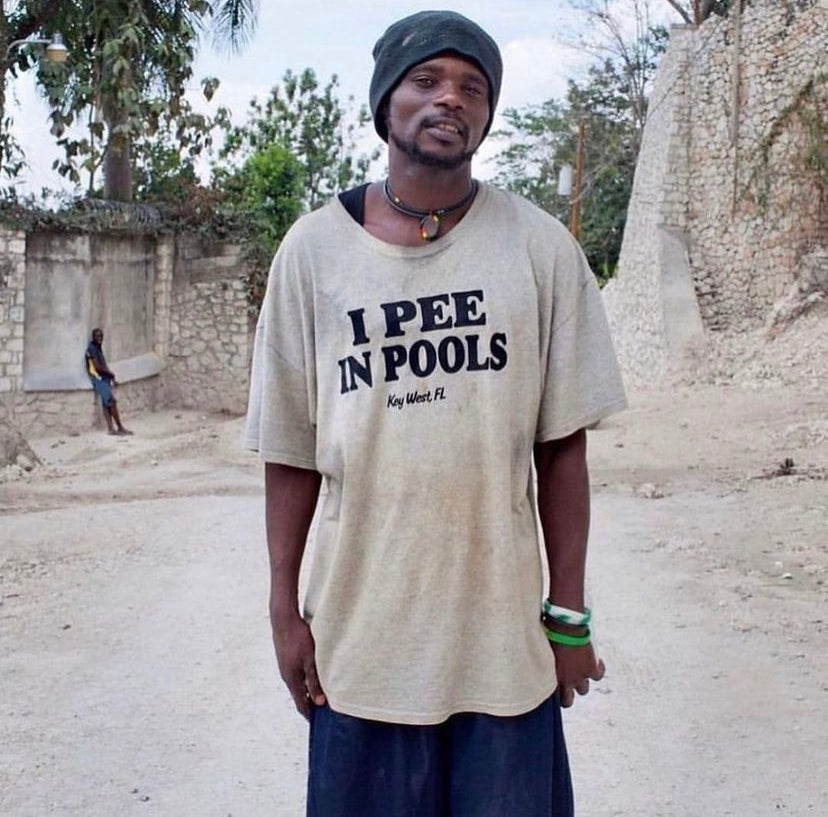 Haitian Villagers Photographed Wearing Absurd ‘Slogan’ Tees by Paolo Woods