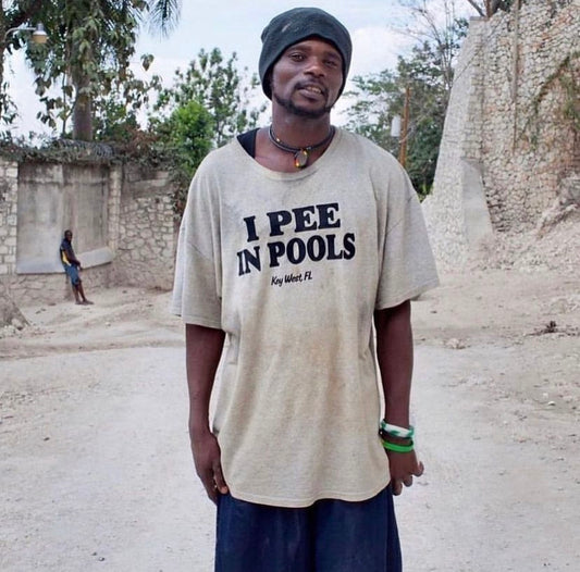 Haitian Villagers Photographed Wearing Absurd ‘Slogan’ Tees by Paolo Woods