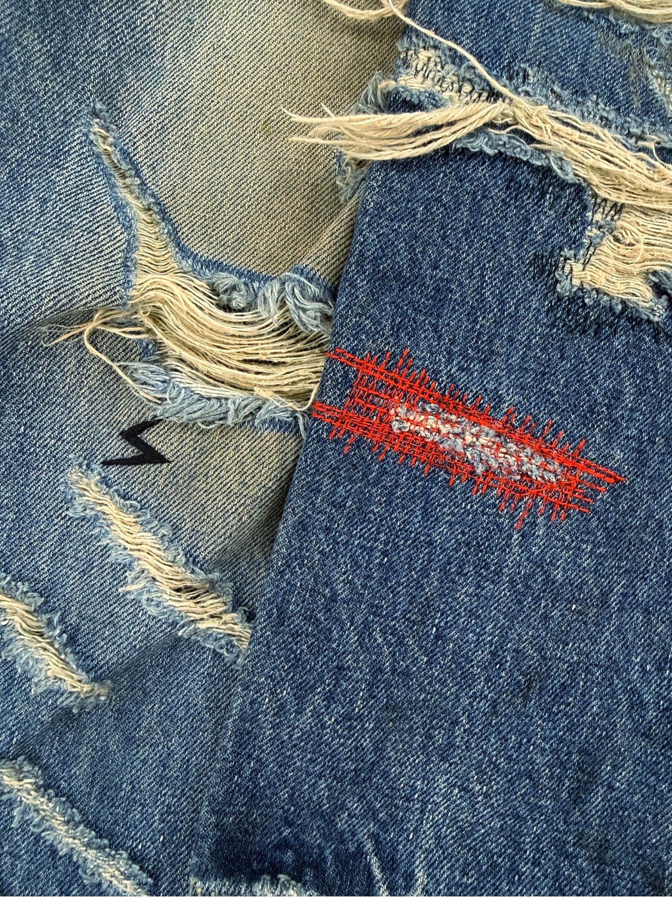 SS05 Undercover ‘But Beautiful’ 60 Red Yarn Distressed Denim Jeans