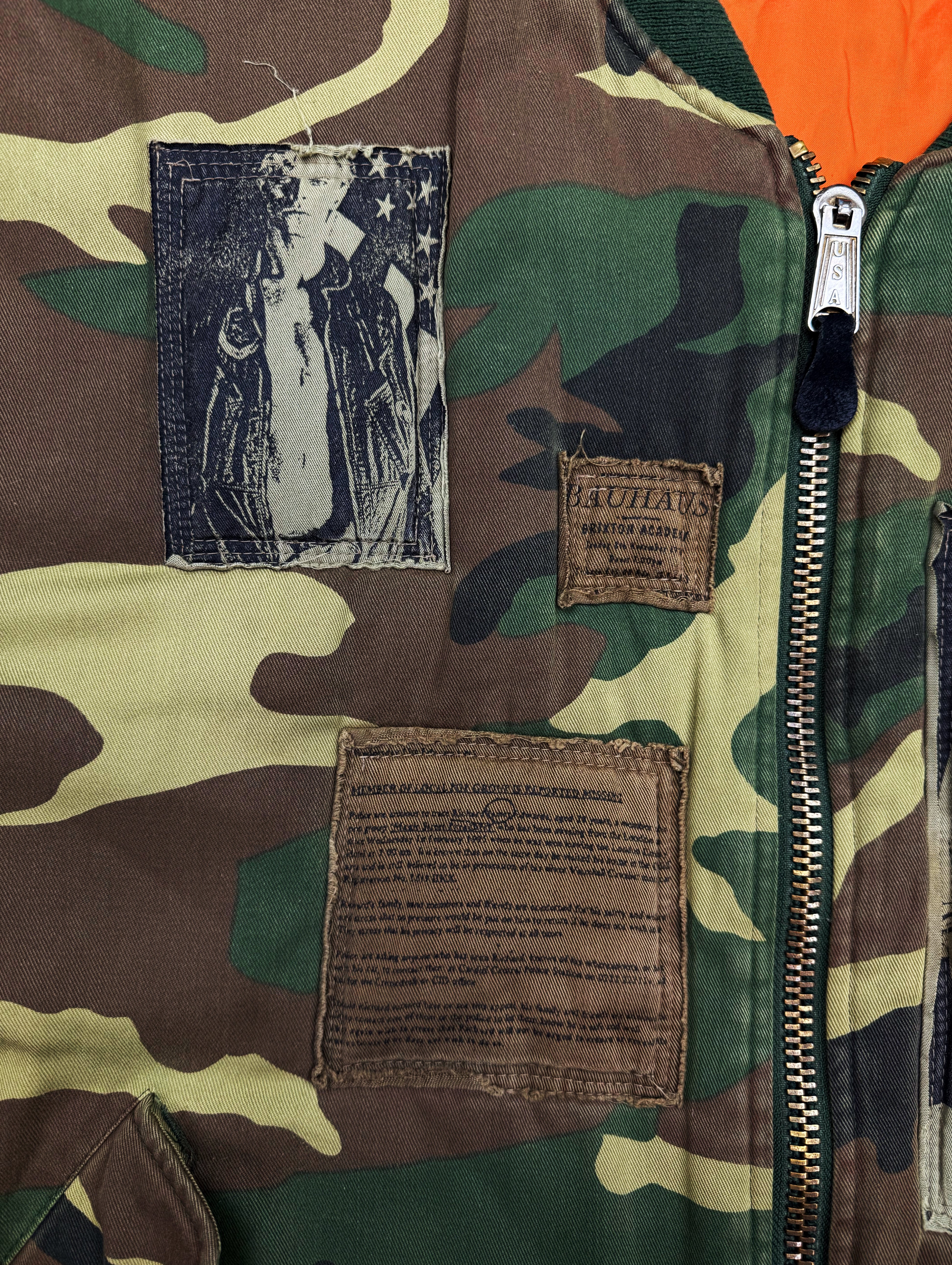 AW01 Raf Simons ‘Riot Riot Riot’ Camouflage Patched Bomber Jacket