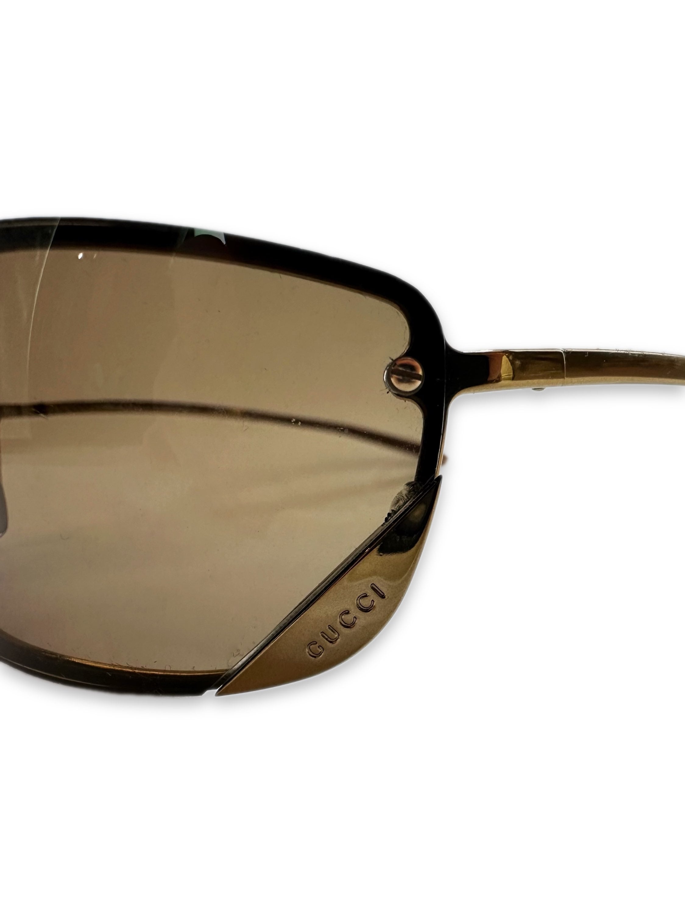 Gucci Rimless Warm Tint Spellout Logo Sunglasses