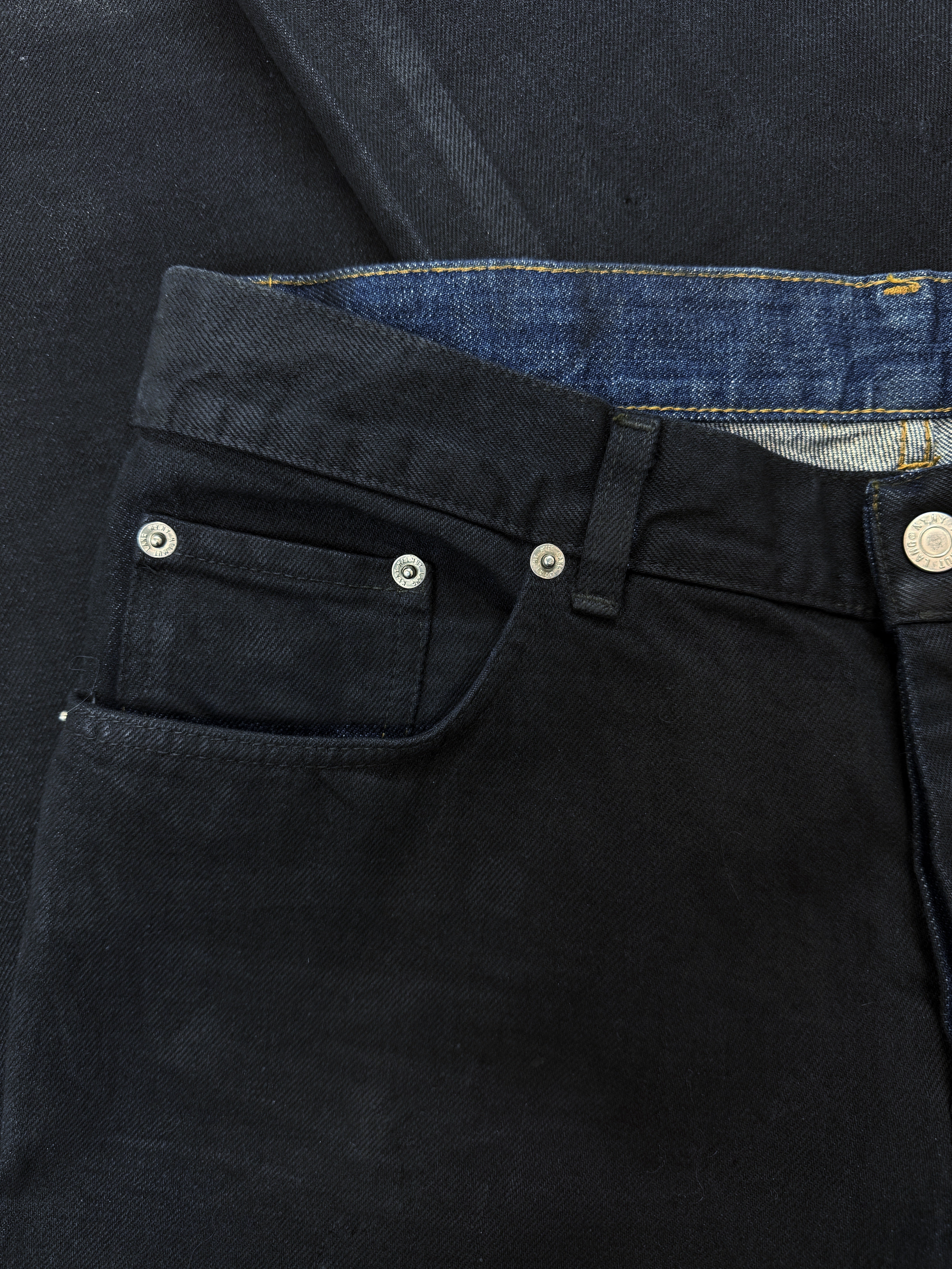 90S HELMUT LANG PAINTED COATED BLACK BOOT CUT BLUE JEANS