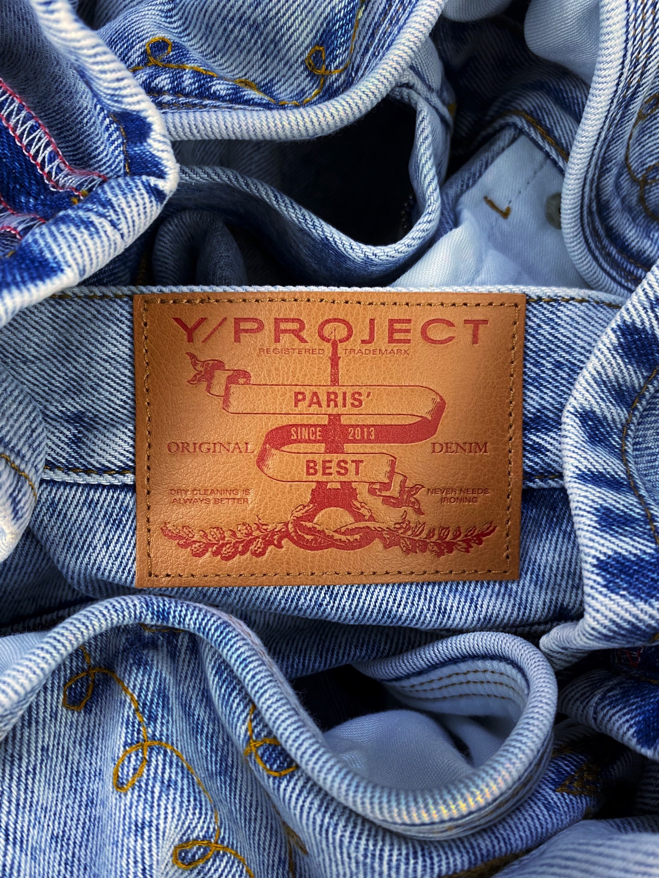 AW21 Y/Project Cowboy Cuff Acid Wash Bootcut Denim Jeans