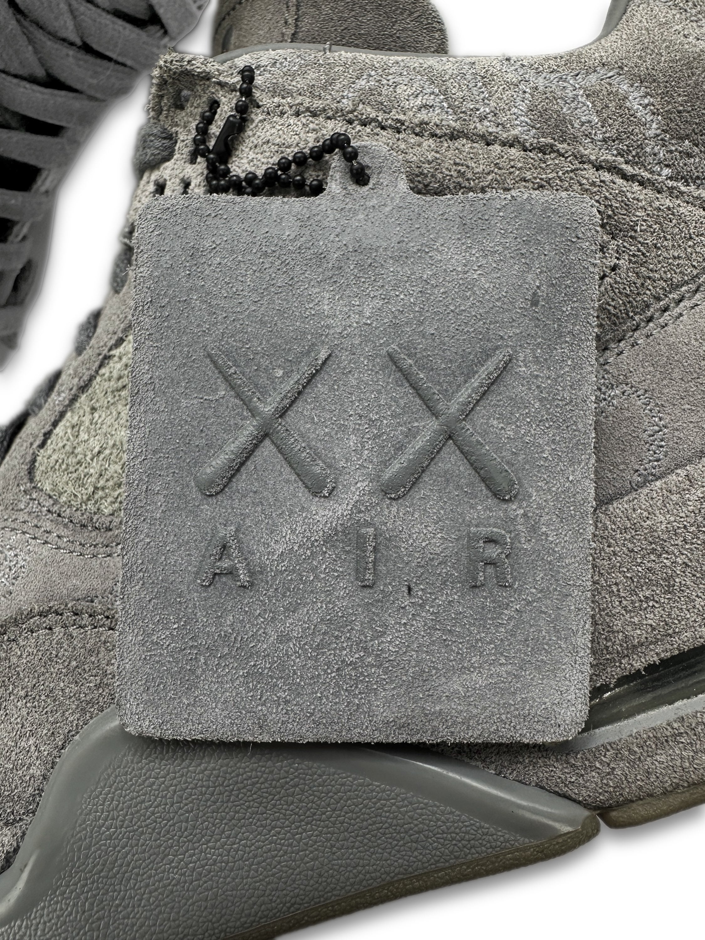 2017 KAWS x Air Jordan 4 Retro ‘Cool Grey’ Suede Sneakers