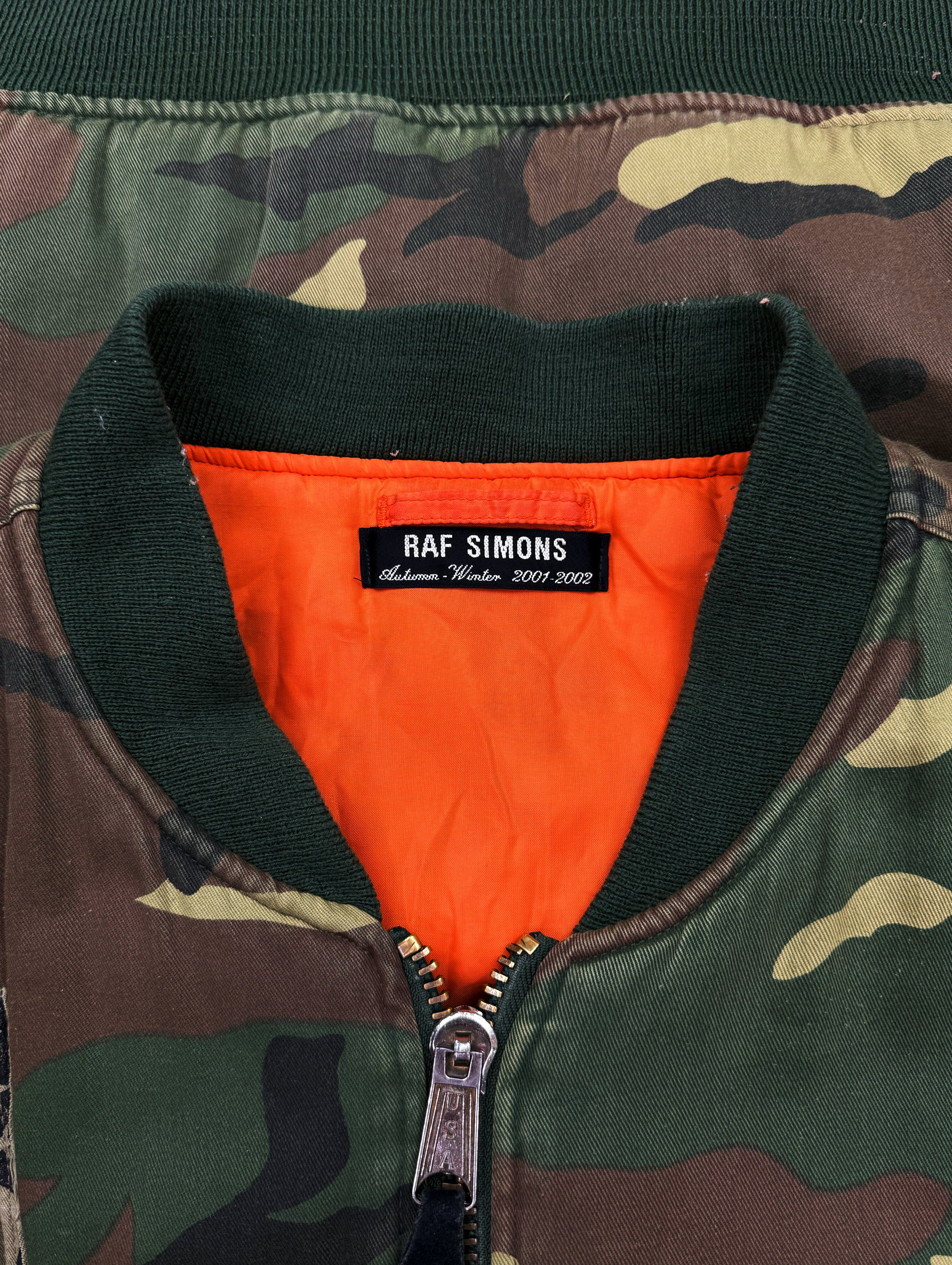 AW01 Raf Simons ‘Riot Riot Riot’ Camouflage Patched Bomber Jacket